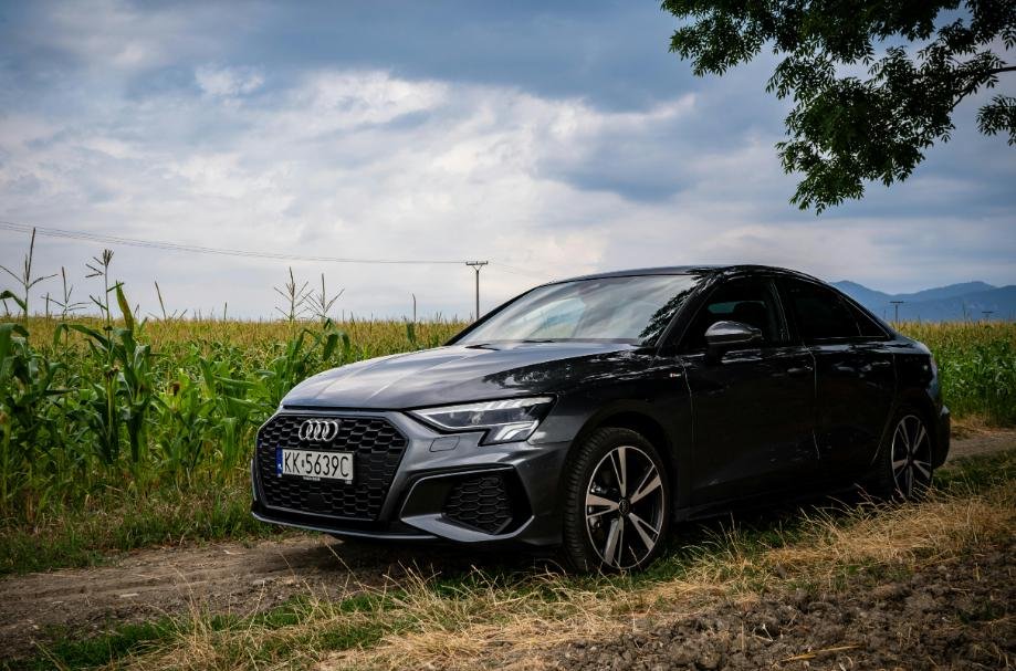A car stranded on a dirt road. 