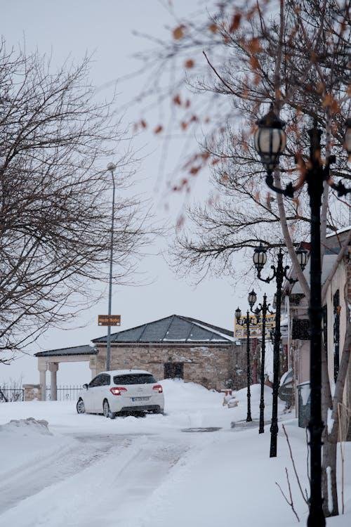 A car stuck in the snow with locked doors, leaving the driver stranded in freezing conditions.