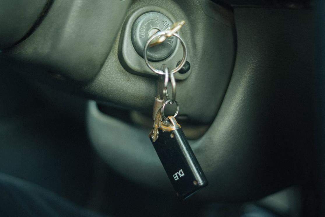 A close-up of a car key in the lock cylinder