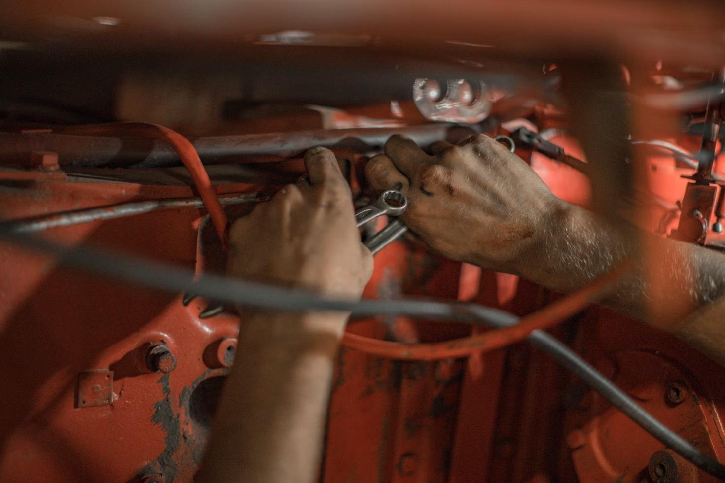 A closeup of hands fixing wires