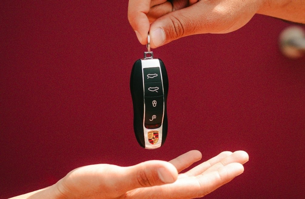 A car key exchange taking place